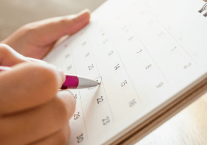 circling annually scheduled professional window cleaning service on calendar