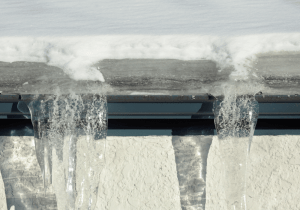 ice dam forming in blocked gutter importance of clean gutters in london ontario
